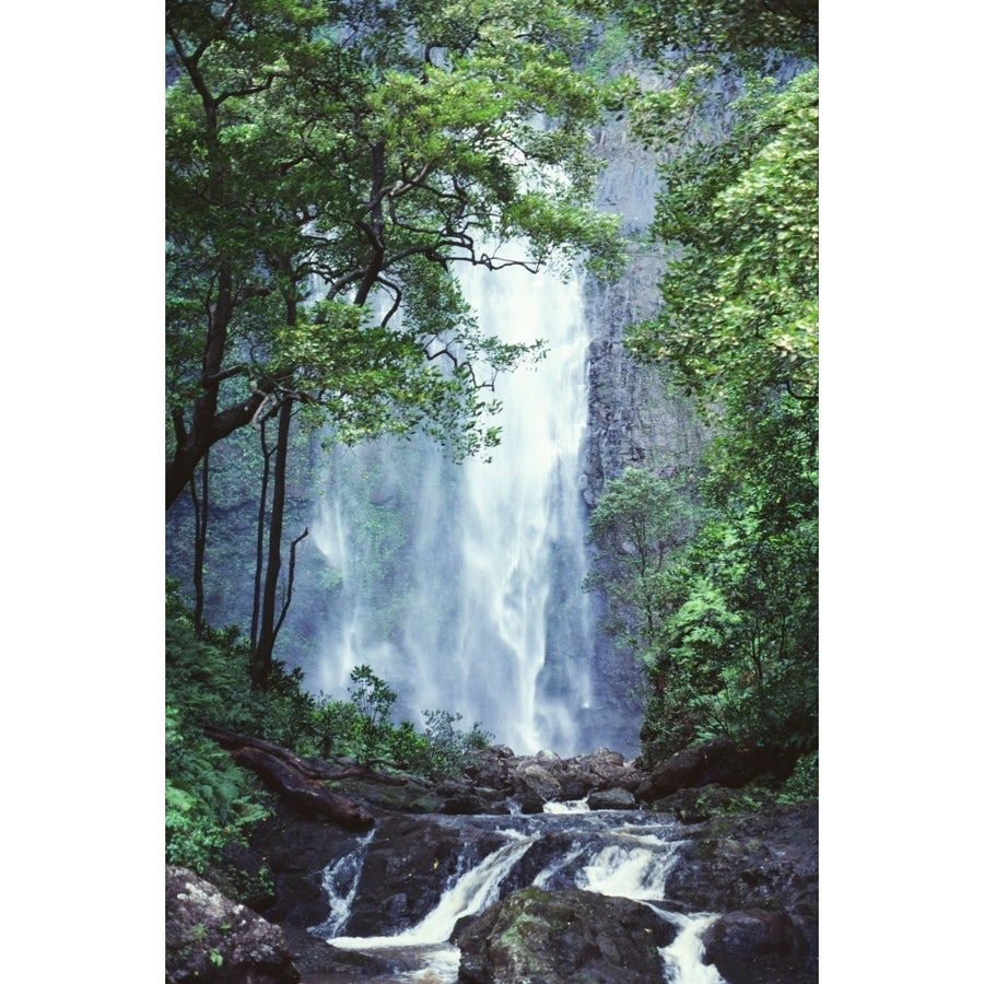 Hawaii Waterfalls Cascading Down Rocky Cliff Trees Overlook Stream In Foreground. Poster Print Image 1