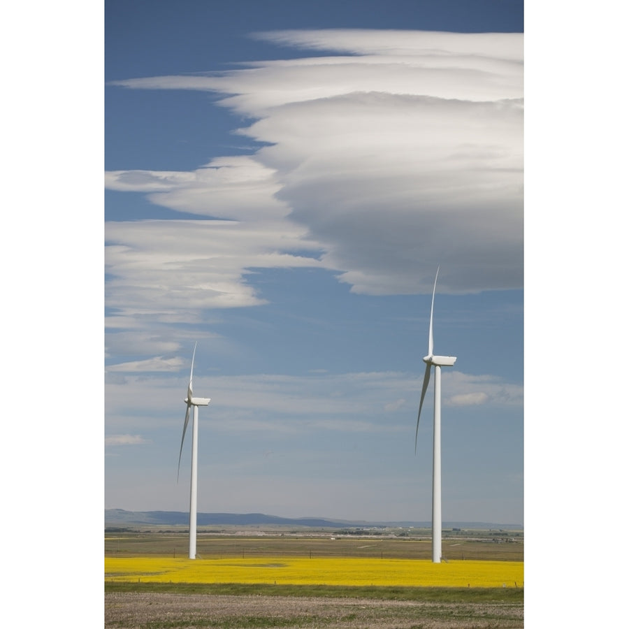 Dramatic Clouds With Blue Sky And Windmills In A Flowering Canola Field; Alberta Canada Poster Print Image 1