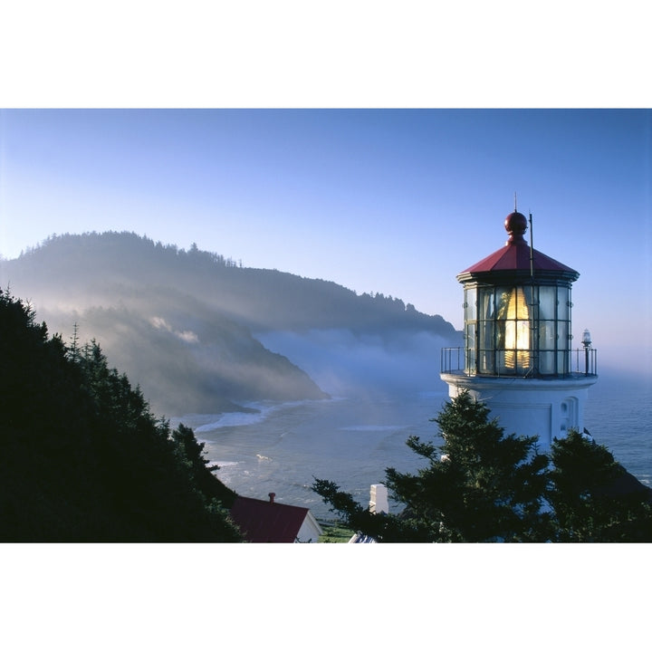 Oregon View Of Heceta Head Lighthouse Early Morning Sun Tree Covered Mountains Poster Print Image 1