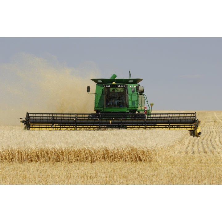 Combine Working A Field On The Prairies Southern Saskatchewan Poster Print Image 1