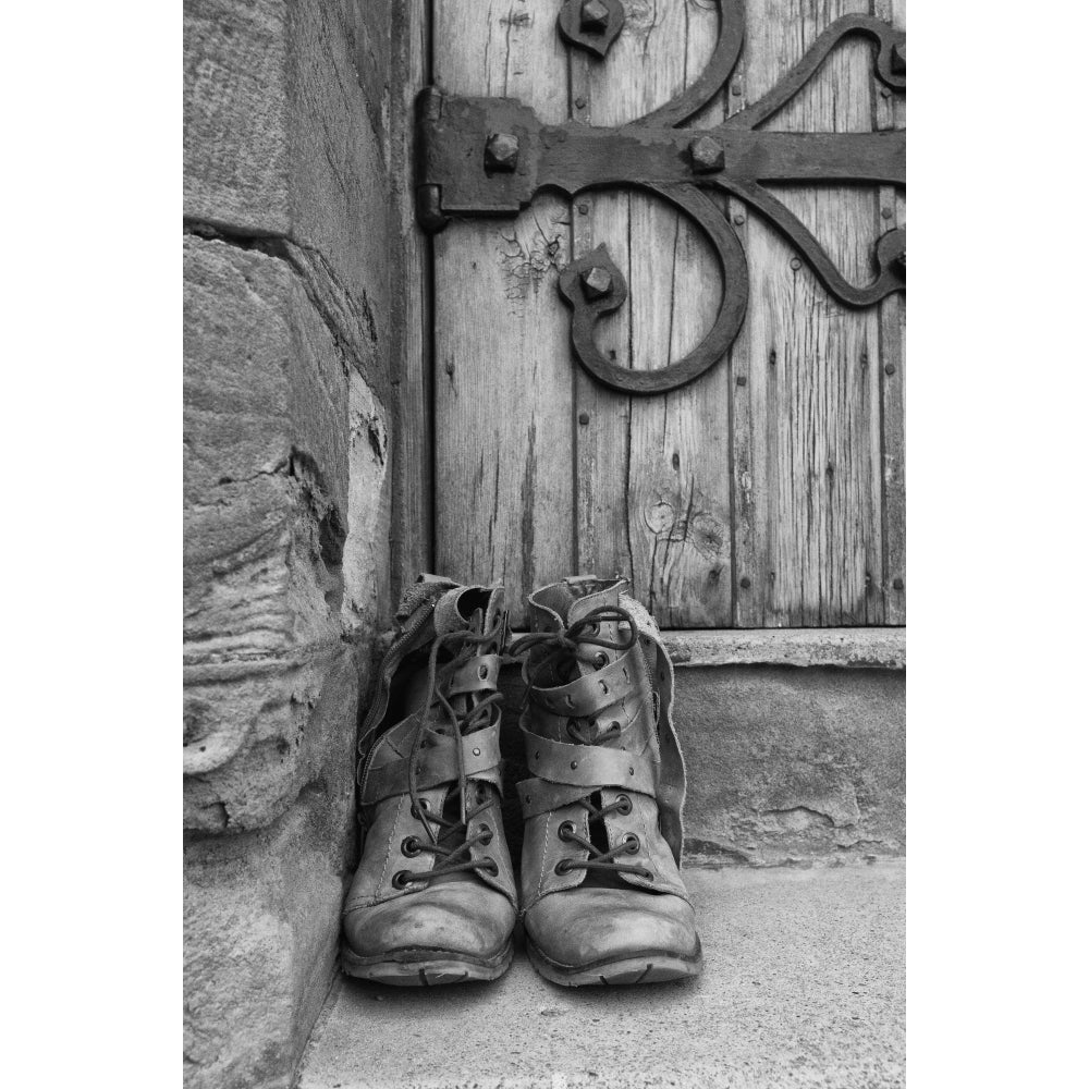 A Pair Of Worn Boots Outside A Door; Northumberland England Poster Print Image 1