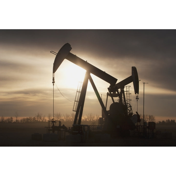 Silhouette Of Two Pump Jacks At Sunrise With Clouds; Alberta Canada Poster Print Image 1