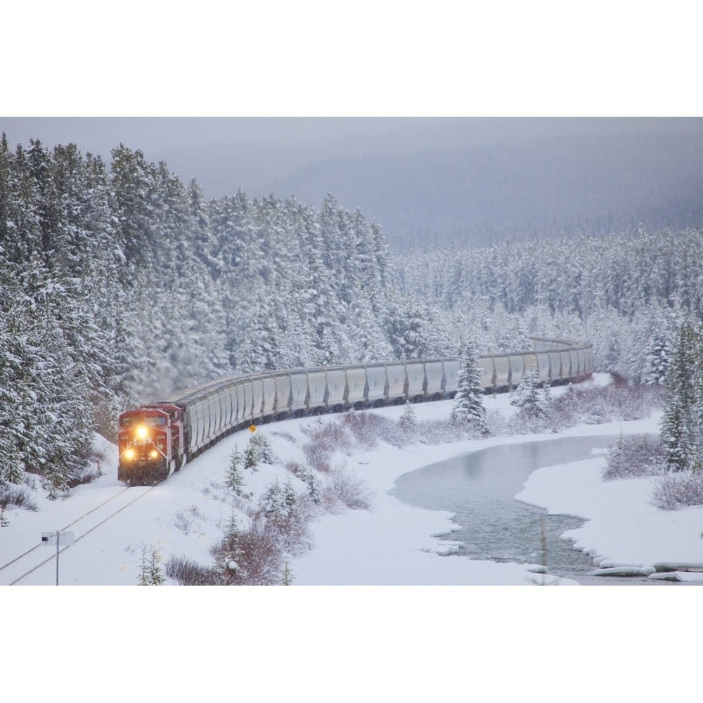 A Canadian Pacific Train Travels Along The Alberta Highway 1A; Lake Louise Alberta Canada Poster Print Image 1