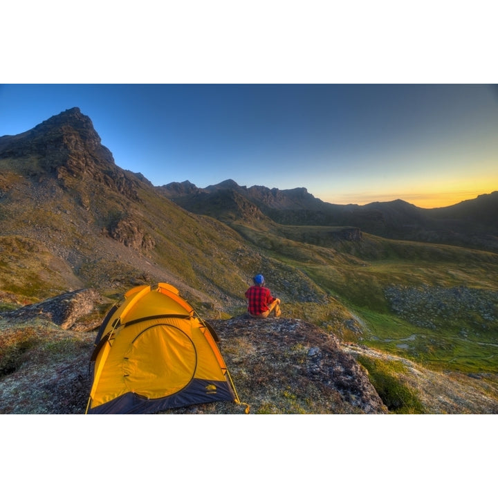 A Man Sitting On A Rock Next To His Tent While Camping Near Hatcher Pass In The Talkeetna Mountains With Bald Ridge In T Image 2