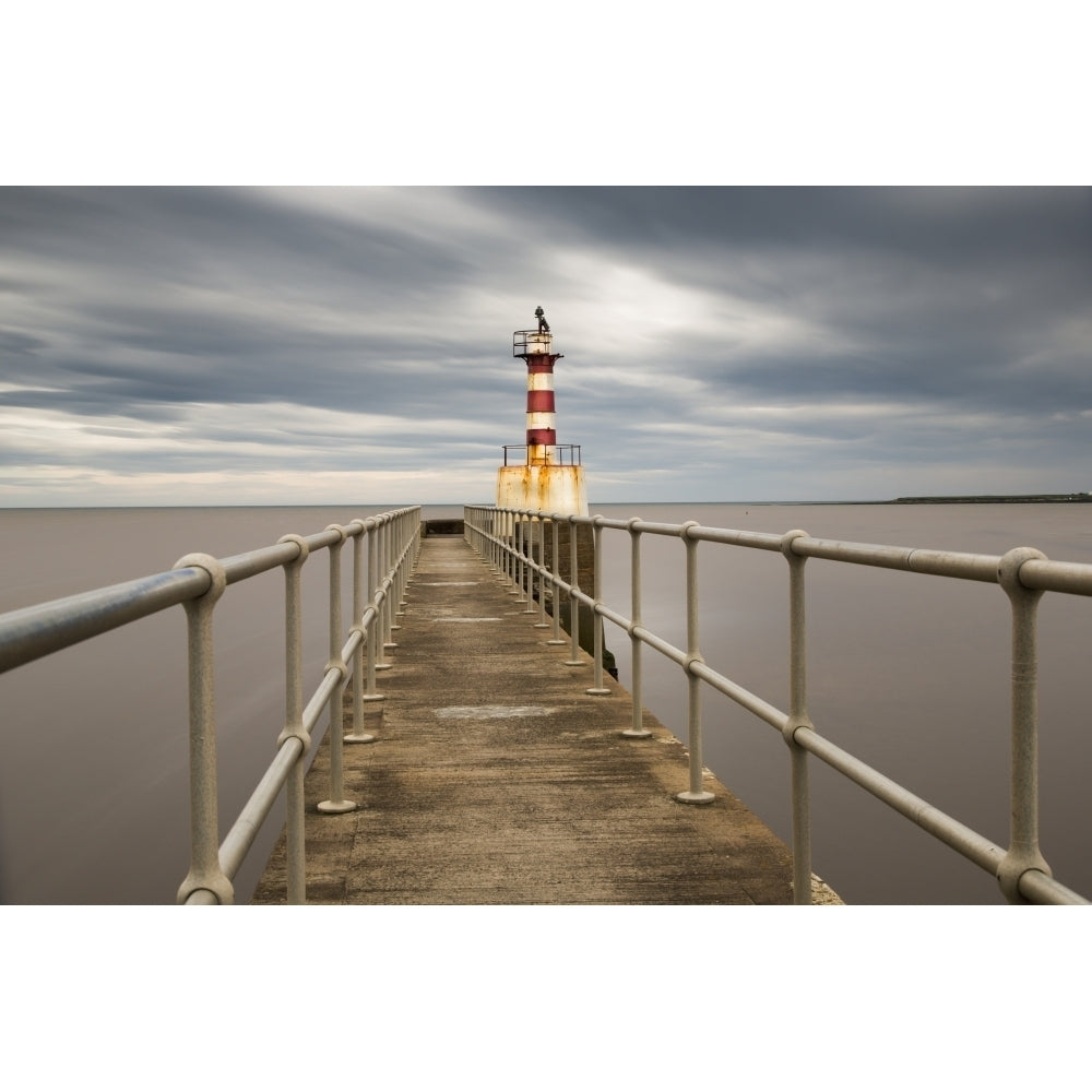 A Red And White Striped Lighthouse At The End Of A Pier; Amble Northumberland England Poster Print Image 1