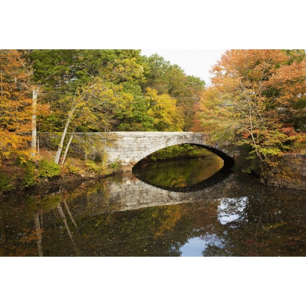 England Massachusetts Blackstone Valley Bridge over river in autumn. Poster Print Image 1