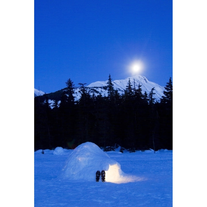 Hand Built Igloo In Moonlight Lit Up With Snowshoes At Entrance Glacier Valley Girdwood Alaska Poster Print Image 1