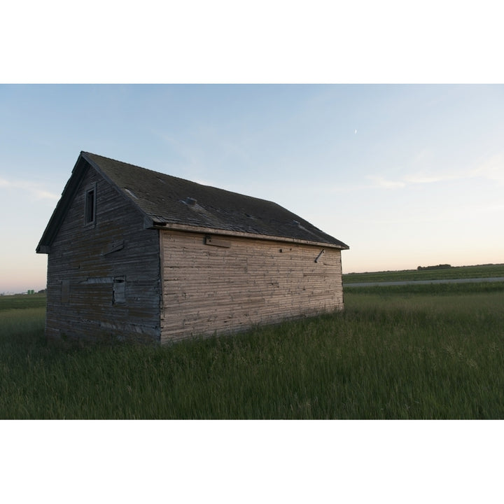 A wooden shed in the middle of a grass field Poster Print Image 2