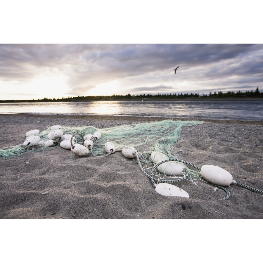 A Gill Net Used For Sockeye Salmon Fishing Stretches Towards The River From The Sandy Bank At Sunset With A Single Bird Image 1