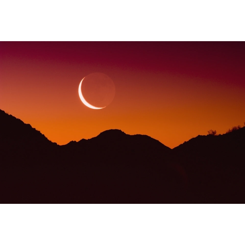 Sunrise over a mountain range in joshua tree national park with the moon in the sky;California united states of america Image 2