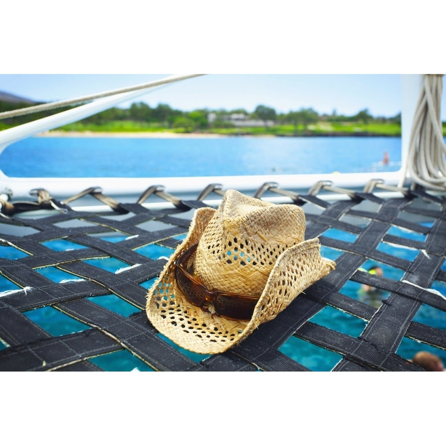 A Sunhat On The Hammock Of A Catamaran Off The Coast Of An Hawaiian Island; Hawaii United States Of America by Kicka Image 1