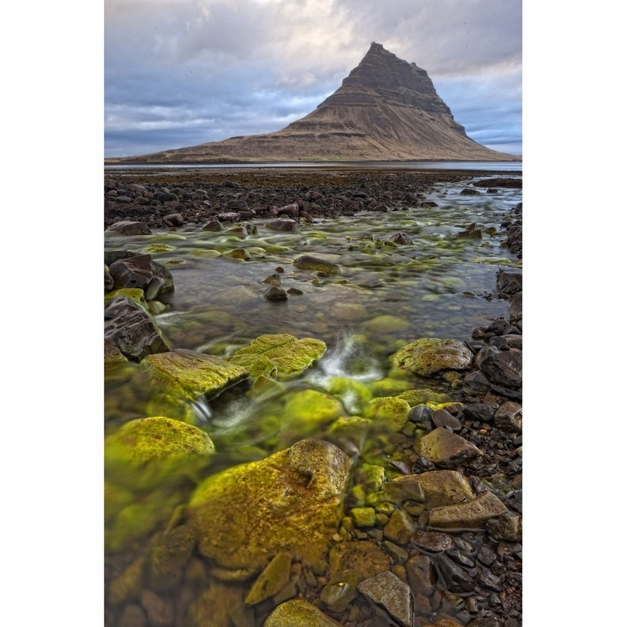 The mountain Kirkjufell rises above the ocean near town of Grundarfjorour Snaefellsnes Peninsula; Iceland Image 1