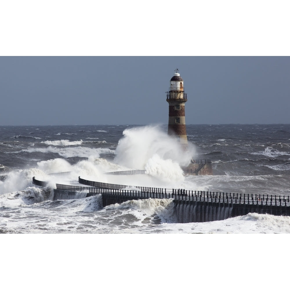 Waves crashing into a lighthouse on the coast;Sunderland Tyne and Wear England Poster Print Image 1