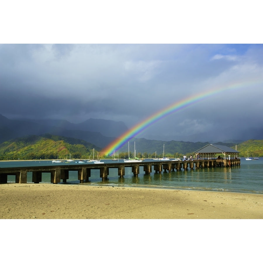 A Rainbow Over Hanalei Pier In Hanalei Bay; Kauai Hawaii United States Of America by Kicka Witte / Design Pics Image 1