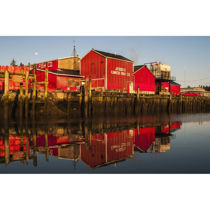 The fishing plant reflected in the Columbia River at the port of Ilwaco; Ilwaco Washington United States of America Po Image 1