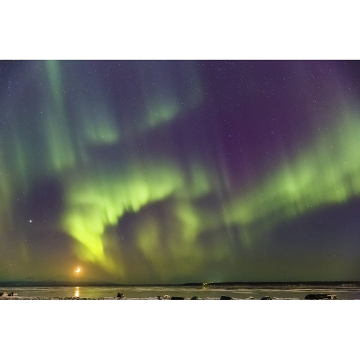 Northern Lights and moon in the sky above the snow covered mudflats of Knik Arm Image 1