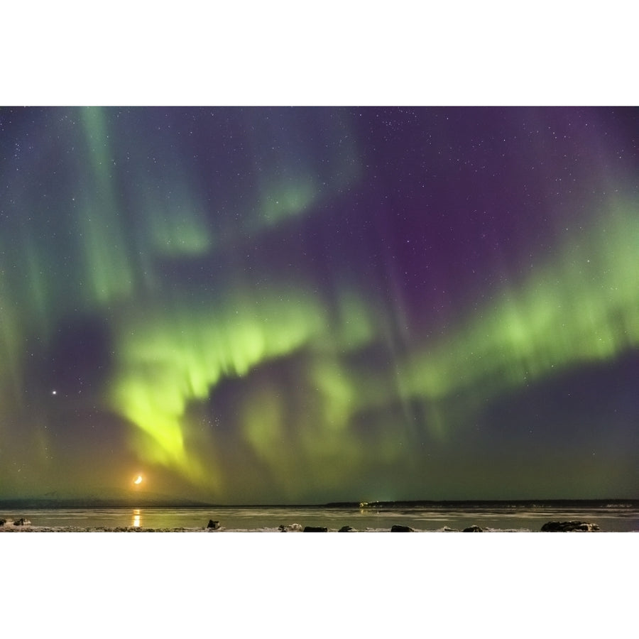 Northern Lights and moon in the sky above the snow covered mudflats of Knik Arm Image 1