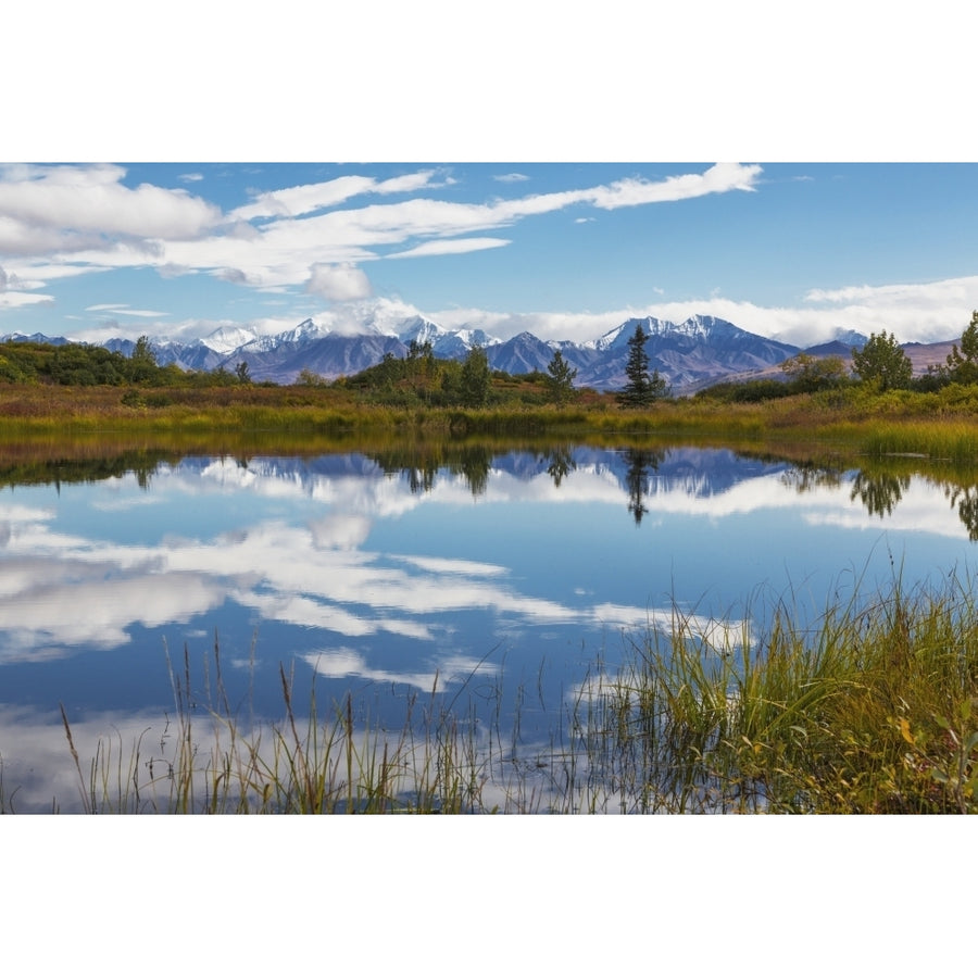 View of the snow capped mountains of the Alaska Range reflected in a pond Fall Image 1