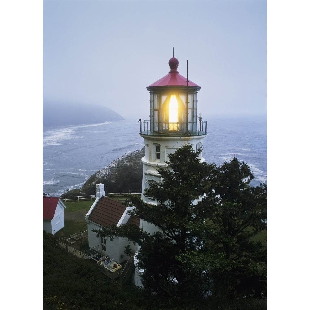 The Heceta Head Lighthouse flashes on a foggy morning; Florence Oregon United States of America Poster Print by Robert Image 2