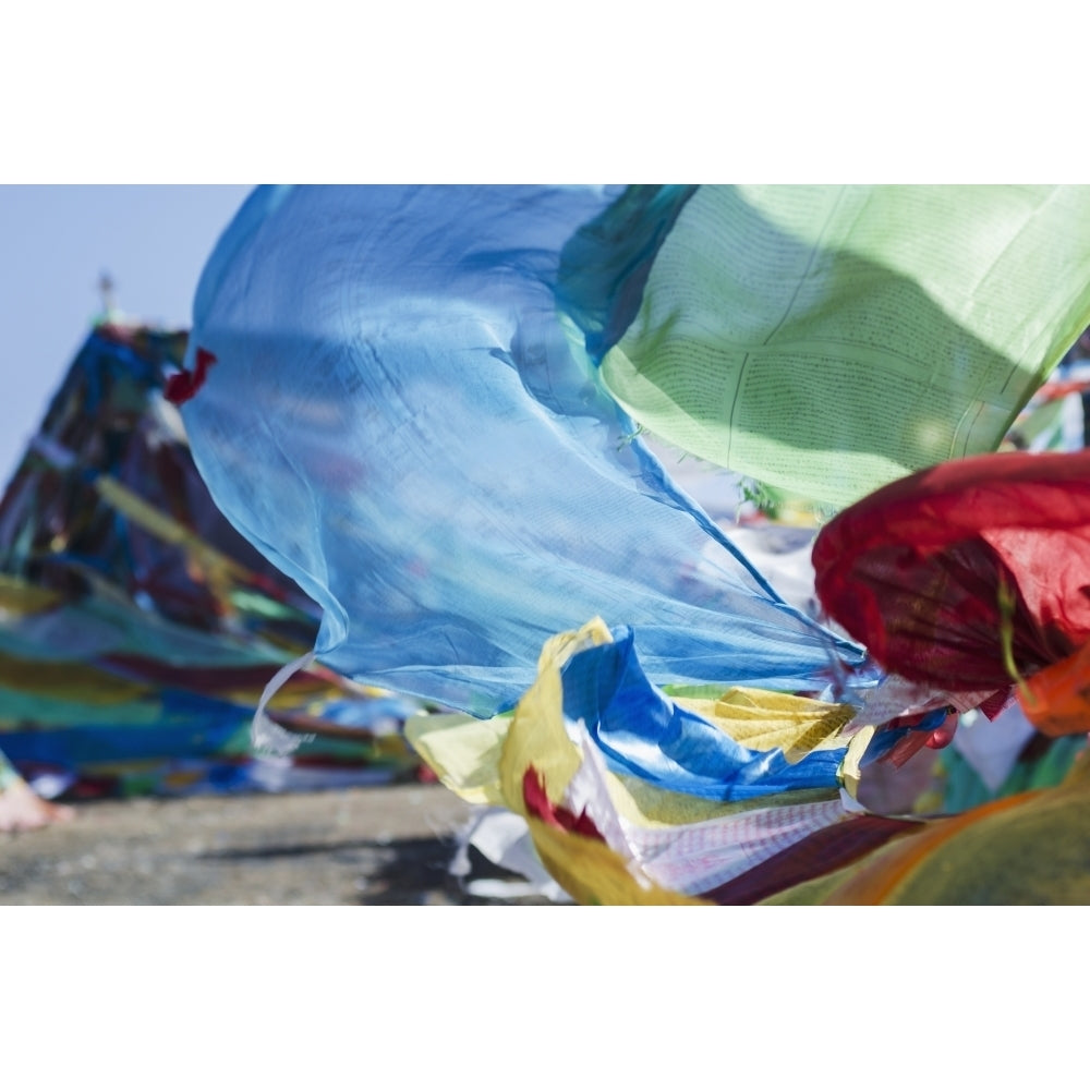 Blessing colourful Tibetan prayer flags under the blue sky; Tibet Poster Print Image 1