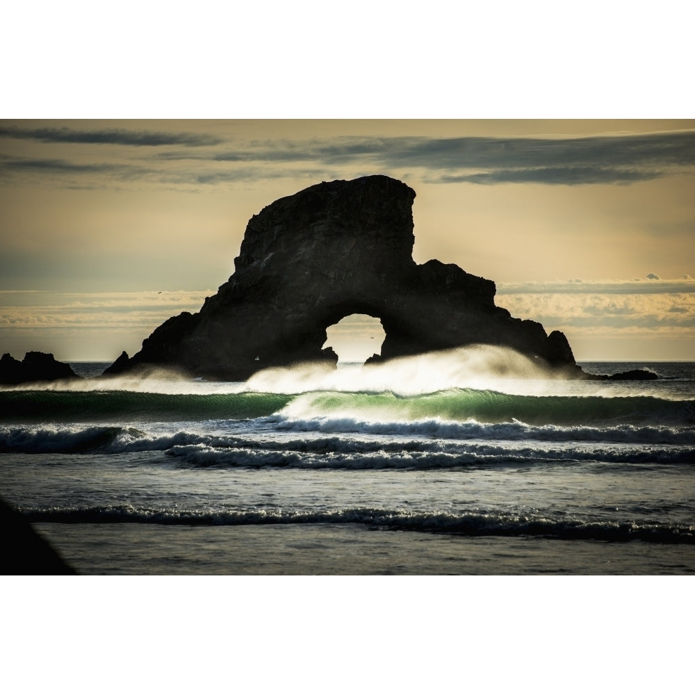 Surf breaks near a natural arch; Cannon Beach Oregon United States of America Poster Print Image 2