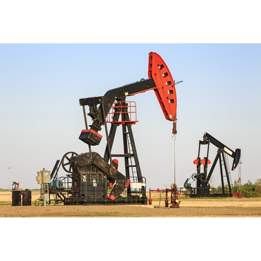 Oil well pump jacks at Bakken Oil Field near Estevan; Saskatchewan Canada Poster Print Image 2