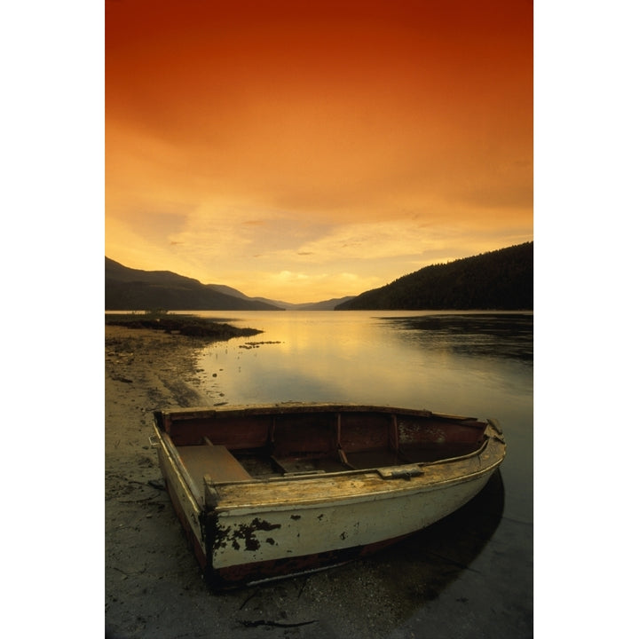 Old Rowboat At Waters Edge With Sunset Background Poster Print Image 1