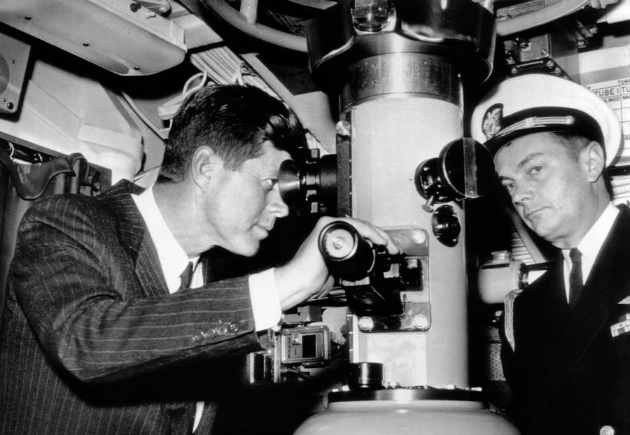 President John Kennedy Looks Through The Periscope Of The Nuclear Submarine Uss Thomas A. Edison. At Right Is His Naval Image 1