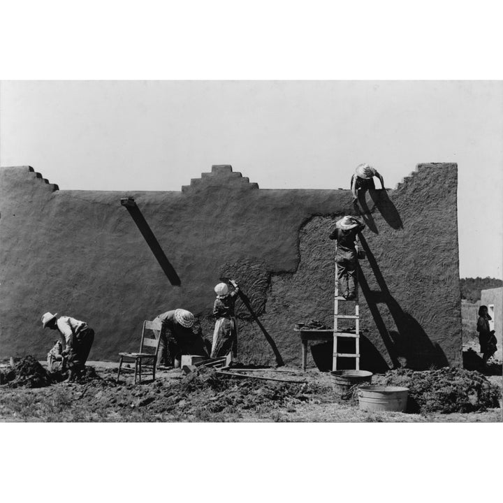 Women Replastering An Adobe House History Image 1