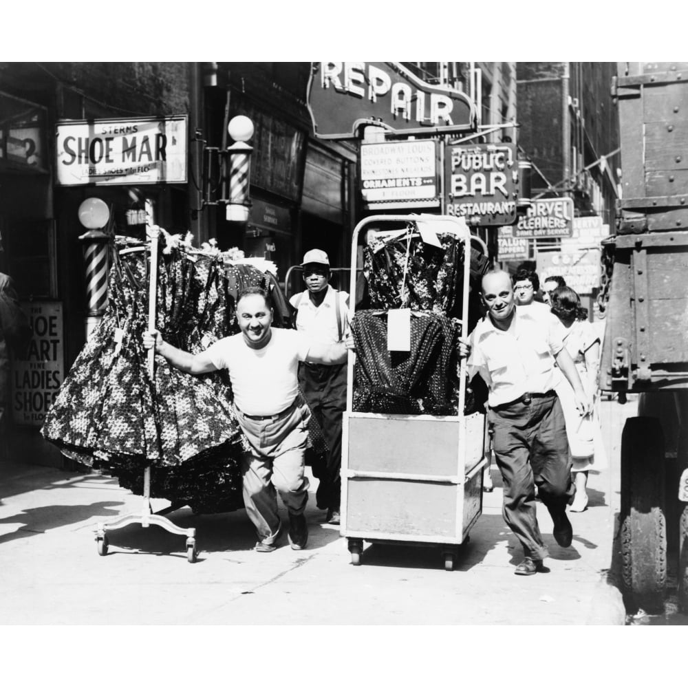 Men Pulling Racks Of Clothing On Busy Sidewalk In Garment District History Image 1