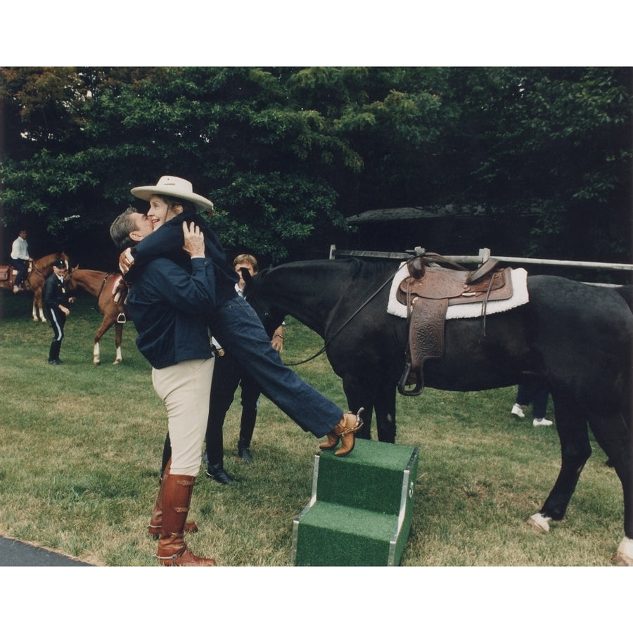 Ronald Reagan Affectionately Assists First Lady Nancy Reagan During Horseback Riding At The Maryland Presidential Image 1