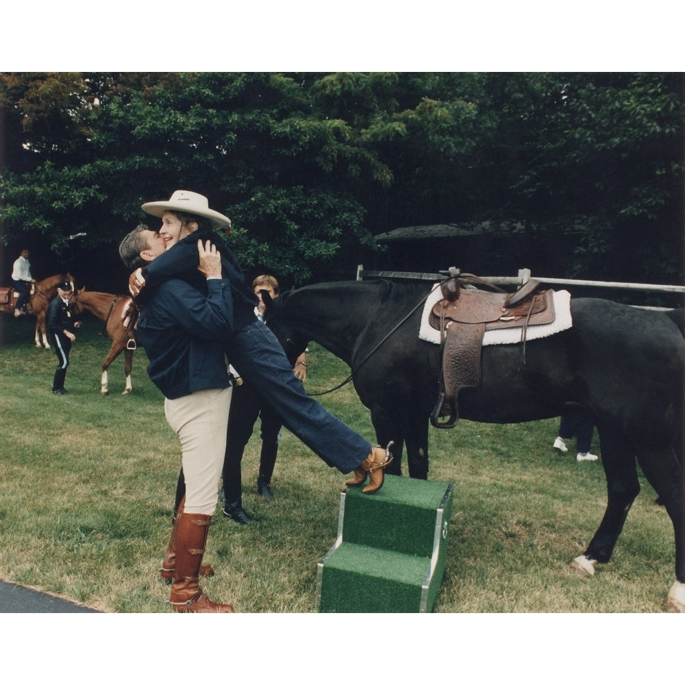 Ronald Reagan Affectionately Assists First Lady Nancy Reagan During Horseback Riding At The Maryland Presidential Image 2