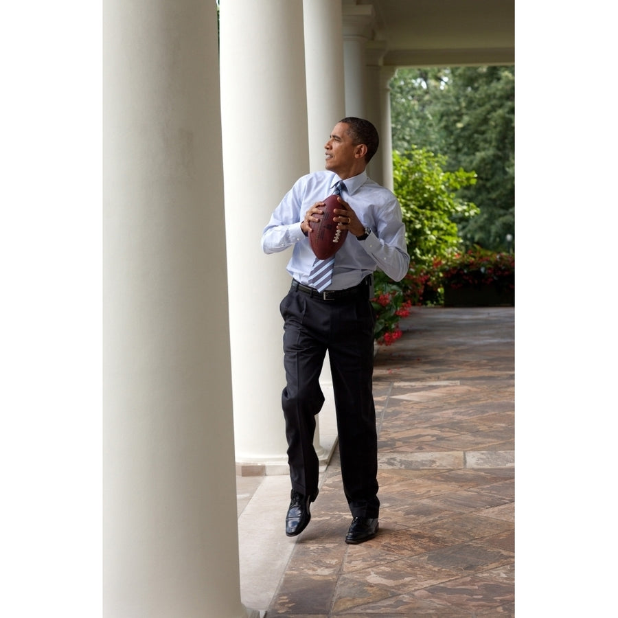 President Barack Obama Prepares To Throw A Football To Personal Aide Reggie Love In The Rose Garden Of The White House Image 1