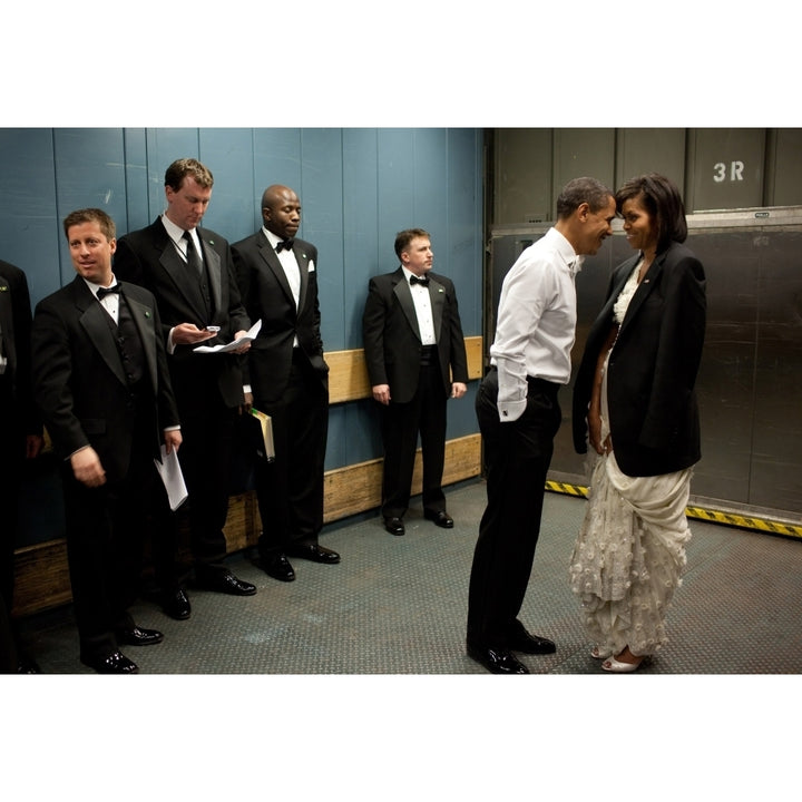 President And Michelle Obama Share A Semi-Private Moment On A Freight Elevator Between Inaugural Balls Amidst Staff And Image 1