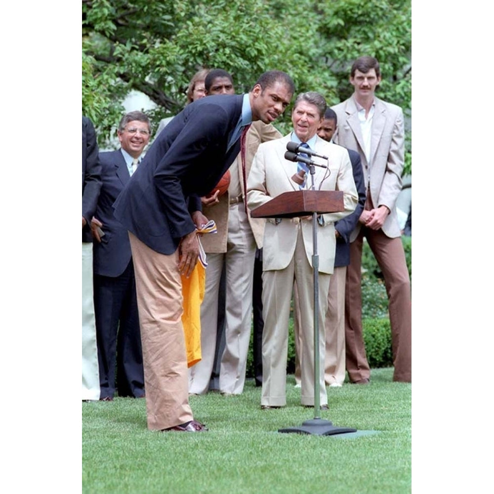 Kareem Abdul Jabbar Bends Over To Speak In The Microphone When President Reagan Hosted The Nba Champion Los Angeles Image 1