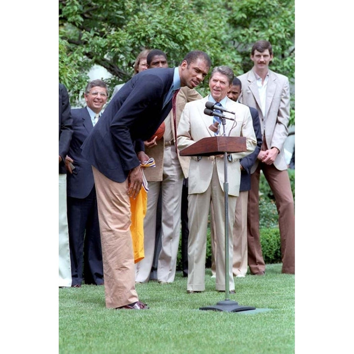 Kareem Abdul Jabbar Bends Over To Speak In The Microphone When President Reagan Hosted The Nba Champion Los Angeles Image 2