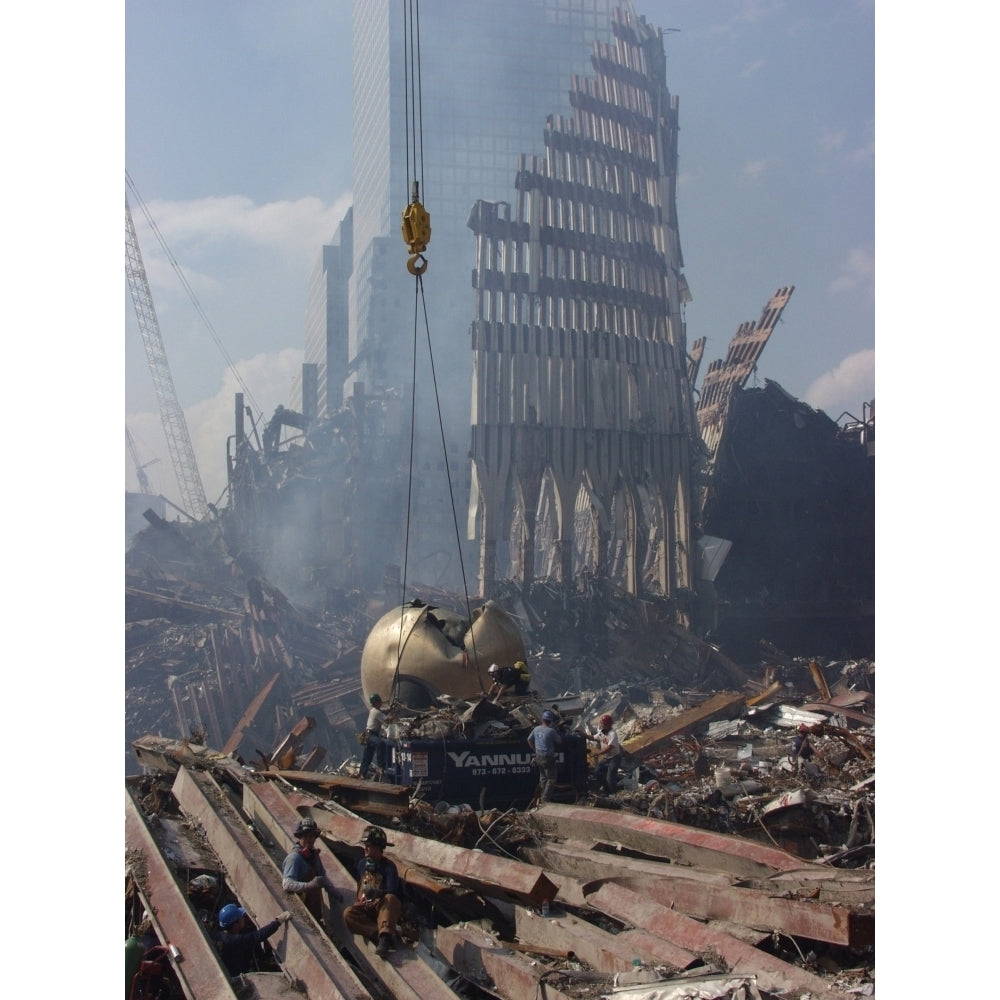 Cables Are Placed Around The Sphere Sculpture By German Sculptor Fritz Koenig Before It Is Hoisted Out Of The Rubble Image 2