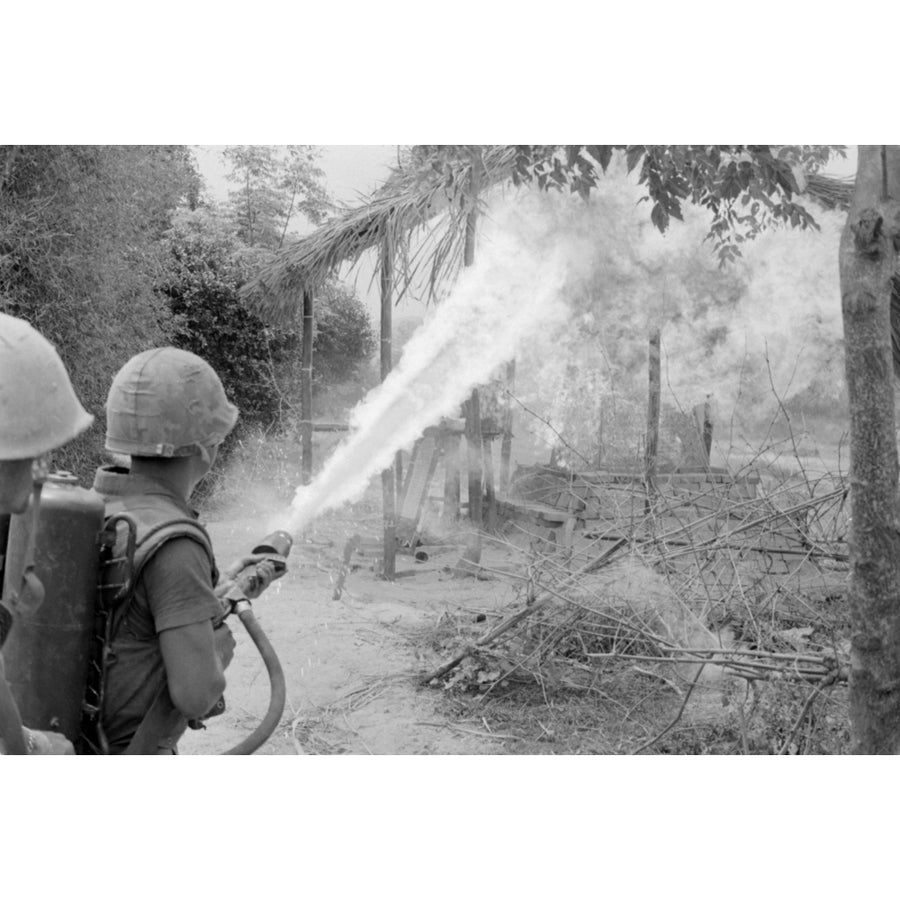 Vietnam War. Us Marines Set Fire To The Remains Of A Building With A Flamethrower During A Search And Destroy Mission In Image 1