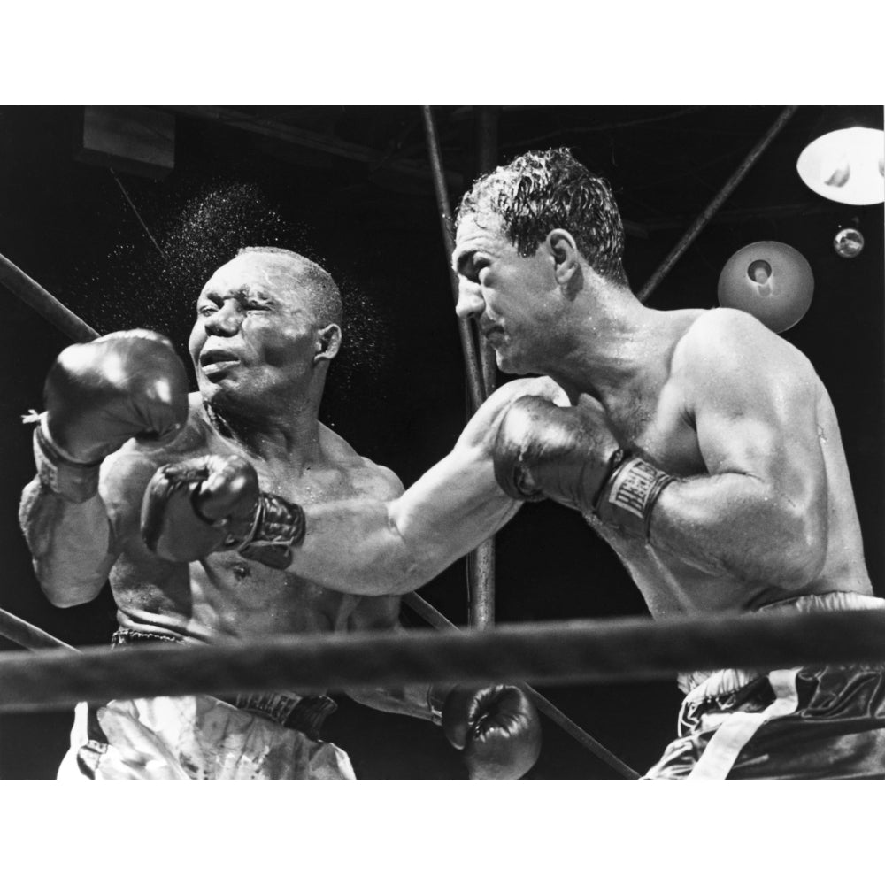 Rocky Marciano Landing A Punch On Jersey Joe Walcott During Their Sept. 23 History Image 2