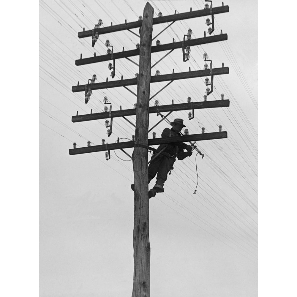 Chesapeake And Potomac Telephone Company Lineman At Work In 1929. Installation And Maintenance Of Utility Lines Created Image 1