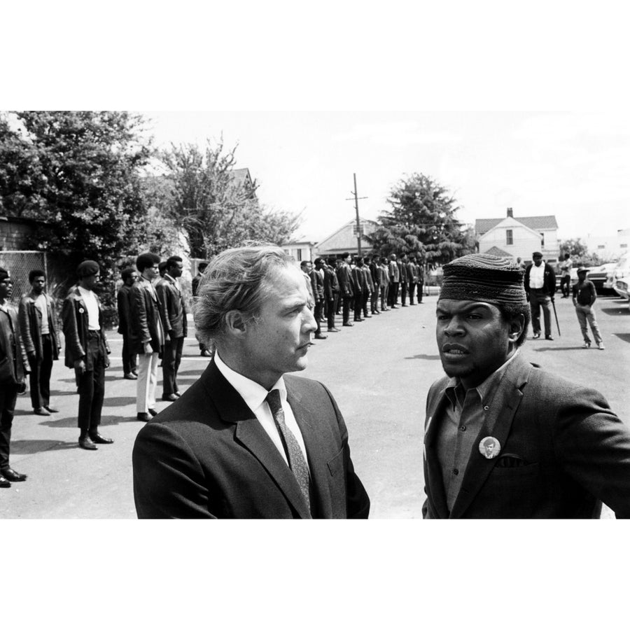 Marlon Brando Talks With Black Panther Captain Kenny Denmon At The Memorial Services Of A Slain Member Of The Group In Image 1