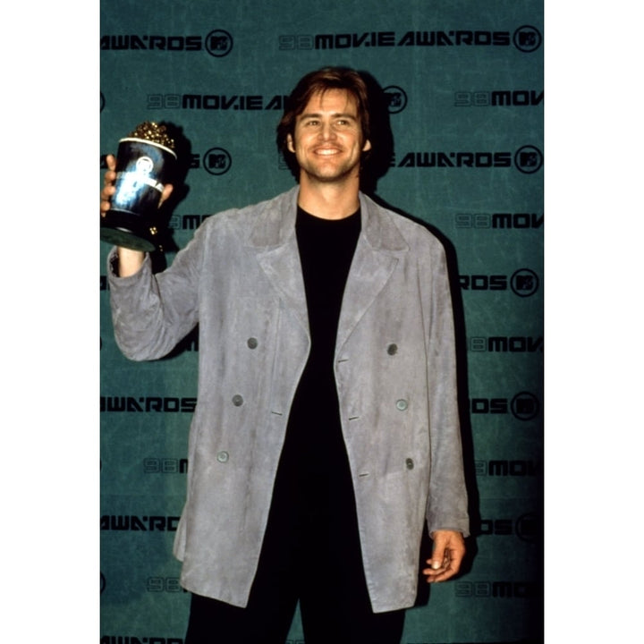 Jim Carrey Holds His Mtv Movie Award Trophy 6198 Celebrity Image 1