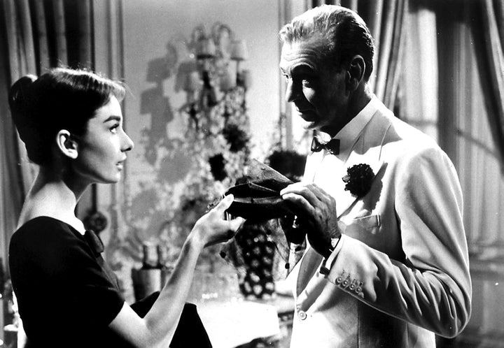 A film still of Audrey Hepburn and Gary Cooper in Love In The Afternoon Photo Print Image 1