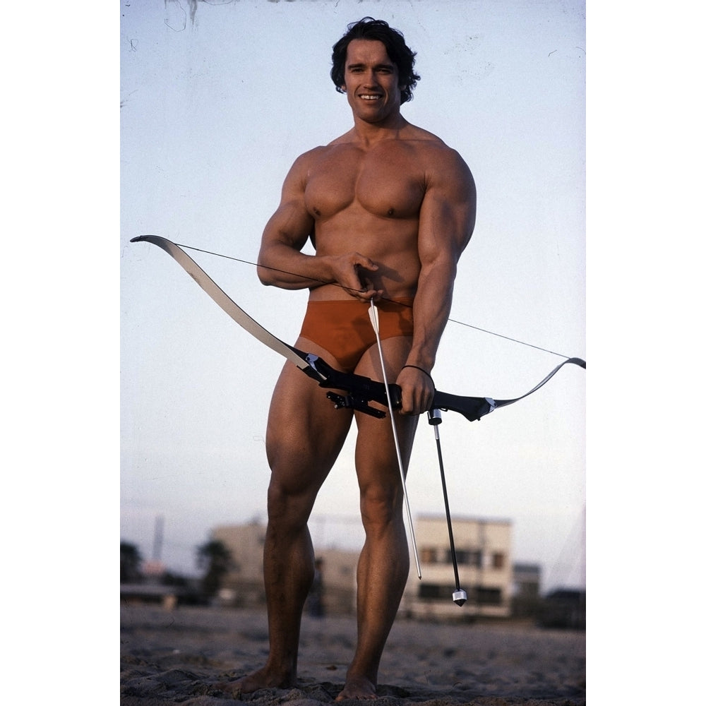 Arnold Schwarzenegger with a bow and arrow Photo Print Image 2