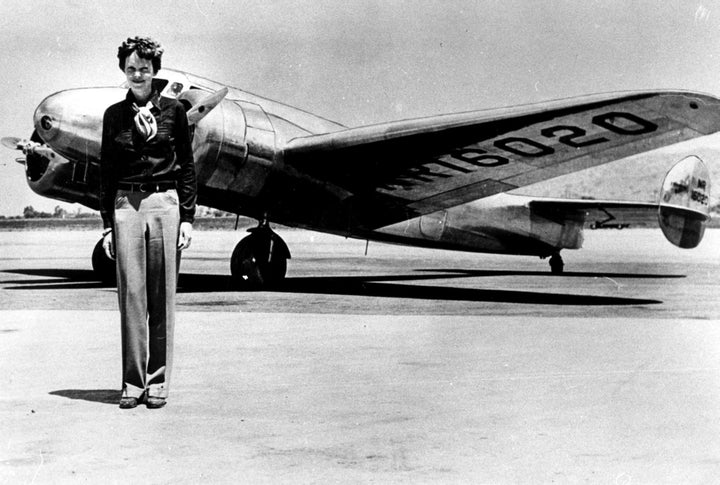 Amelia Earhart by an airplane Photo Print Image 1