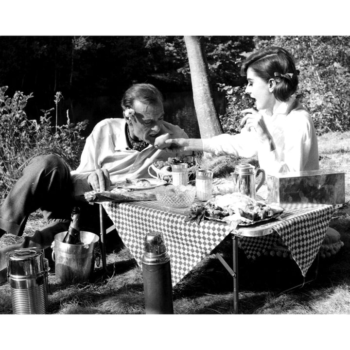 Film Still of Audrey Hepburn and Gary Cooper having a picnic in Love In The Afternoon Photo Print Image 1