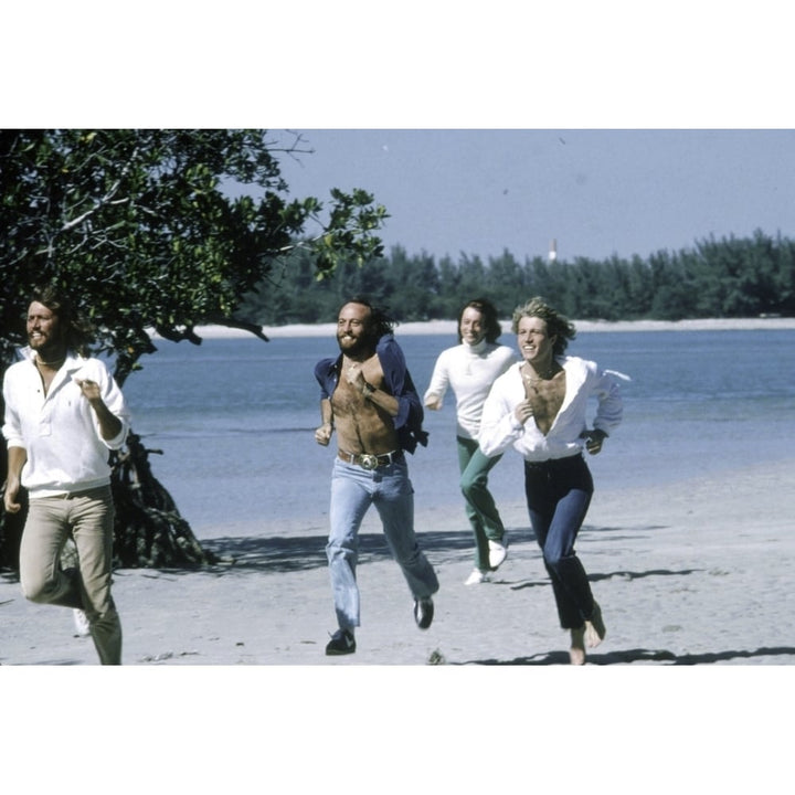 the Bee Gees running at a beach Photo Print Image 1