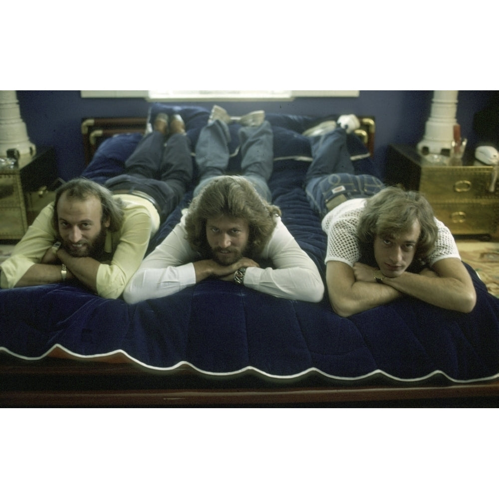 the Bee Gees lying on a bed Photo Print Image 1