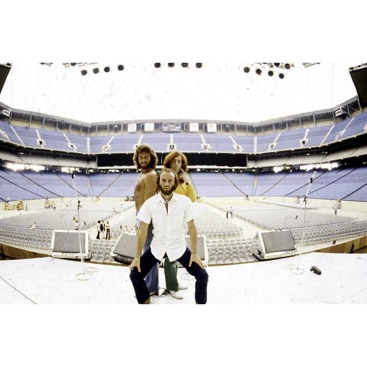 the Bee Gees on stage at an empty stadium Photo Print Image 2