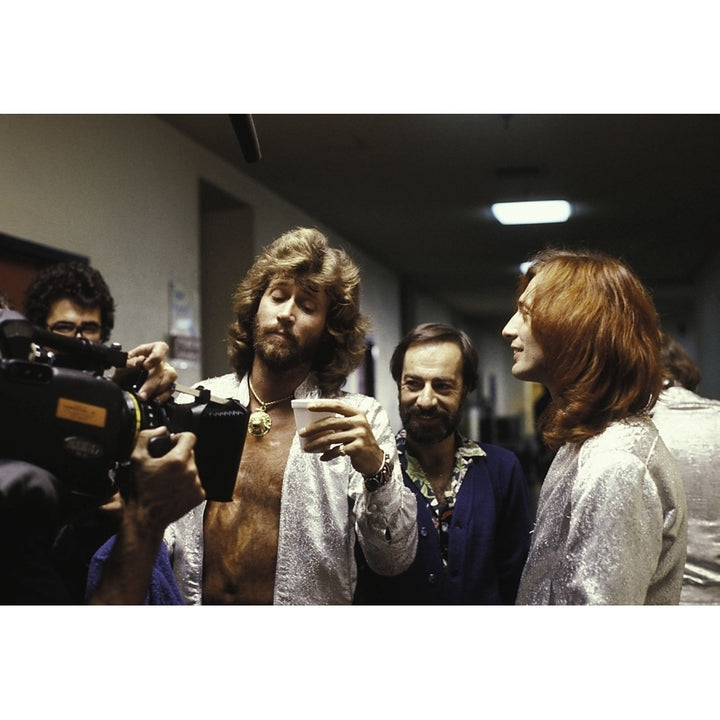 the Bee Gees in front of a camera Photo Print Image 1